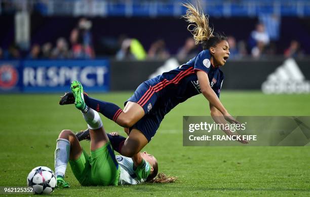 Olympique Lyonnais' French midfielder Delphine Cascarino is tackled by Wolfsburg's Swiss defender Noelle Maritz during the UEFA Women's Champions...