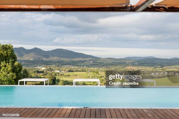 luxury hotel swimmin pool in the morning - pepmiba stock pictures, royalty-free photos & images