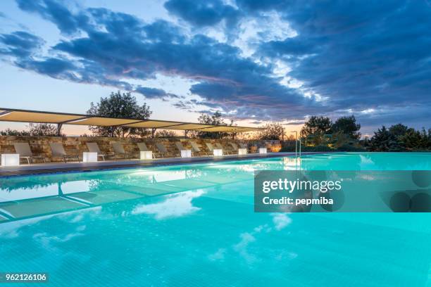 luxury hotel swimmin pool at night - pepmiba stock pictures, royalty-free photos & images