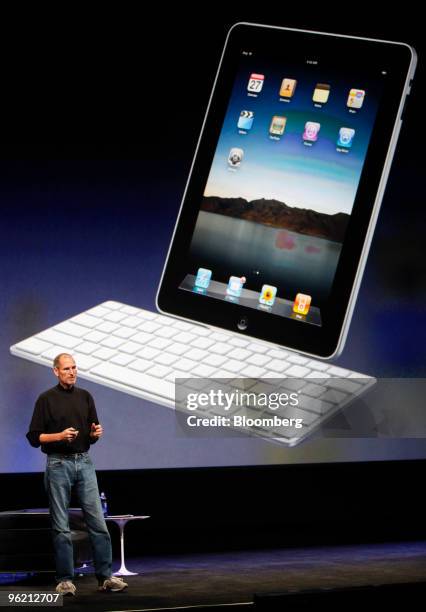 An Apple iPad connected to an optional keyboard is displayed as Steve Jobs, chief executive officer of Apple Inc., speaks during the debut of the...