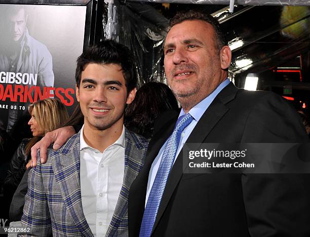 Musician Joe Jonas and producer Tim Headington arrive at the "Edge Of Darkness" premiere held at Grauman's Chinese Theatre on January 26, 2010 in...