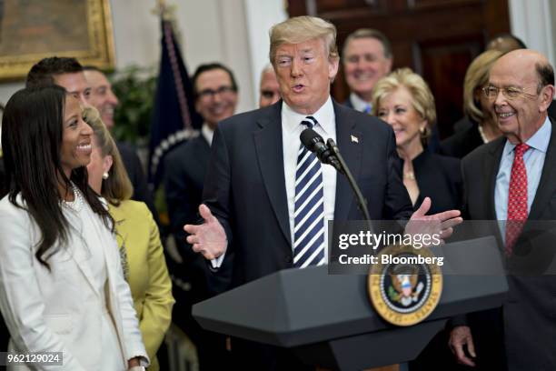 President Donald Trump speaks as Wilbur Ross, U.S. Commerce secretary, right, listens before signing S. 2155, the Economic Growth, Regulatory Relief,...