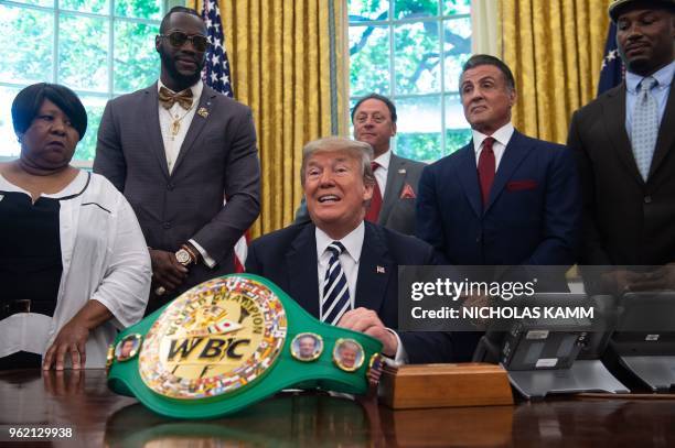 President Donald Trump speaks before signing a posthumous pardon for former world champion boxer Jack Johnson in the Oval Office at the White House...