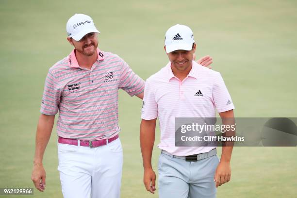 Jimmy Walker of the United States and Xander Schauffele of the United States react on the 18th green during the final round of THE PLAYERS...