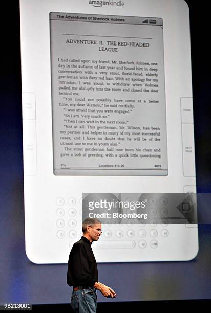 An Amazon Kindle e-reader is displayed as Steve Jobs, chief executive officer of Apple Inc., speaks about the iBooks application for the iPad during...