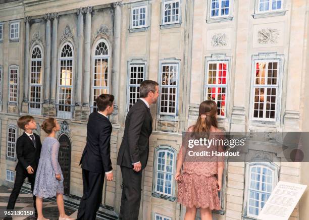 In this handout image provided by MEW and The National History Museum, Crown Prince Frederik of Denmark, with children Prince Christian, Princess...