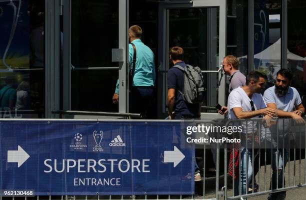 People drink beer near UEFA superstore entrance at a fan zone in Kyiv, Ukraine, May 24, 2018. Official UEFA Champions League Final fan zone opened...