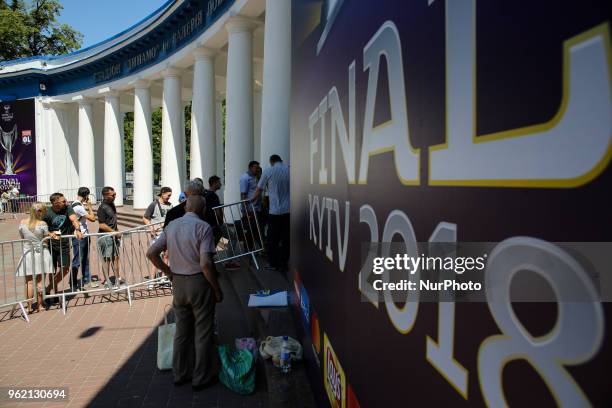 People stay in a queue to buy tickets for UEFA Women's Champions League Final between Wolfsburg and Olympique Lyonnais in Kyiv, Ukraine, May 24,...