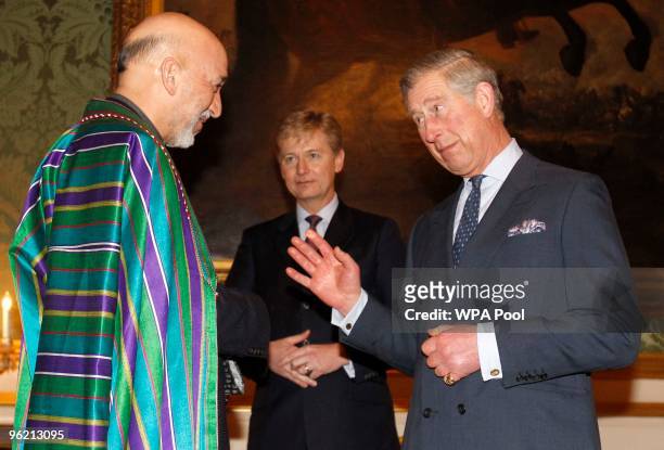 Britain's Prince Charles, Prince of Wales speaks with Afghan President Hamid Karzai during a reception for the delegates of Afghanistan: The London...