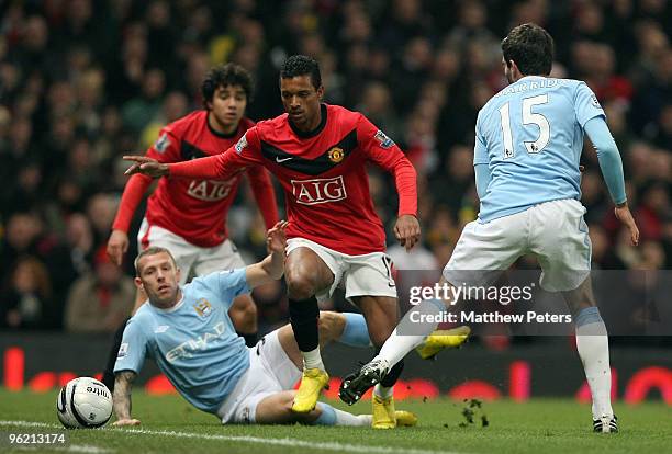 Nani of Manchester United clashes with Craig Bellamy of Manchester City during the Carling Cup Semi-Final Second Leg match between Manchester United...