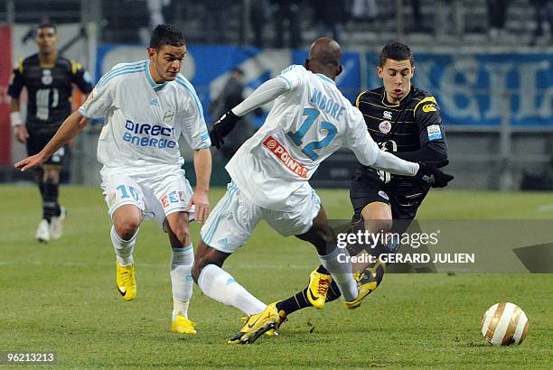 Lille's midfielder Eden Hazard vies with Marseille's midfielder Charles Kabore and forward Hatem Ben Arfa during the French League Cup football match...