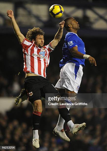 Sylvain Distin of Everton battles with Lorik Cana of Sunderland during the Barclays Premier League match between Everton and Sunderland at Goodison...