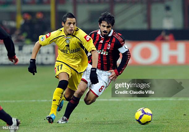 Gennaro Gattuso of AC Milan competes for the ball with Alexis Sanchez of Udinese Calcio during the Tim Cup match between Milan and Udinese at Stadio...