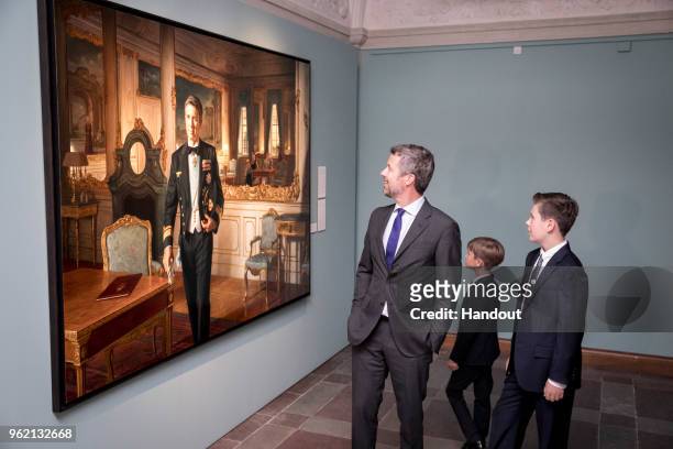 In this handout image provided by MEW and The National History Museum, Crown Prince Frederik of Denmark, with children Prince Christian and Prince...