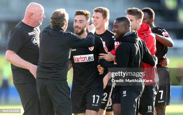 Maximilian Zimmer of Cottbus jubilates with team mates after scoring the third goal during the Third League Playoff Leg 1 match between SC Weiche...