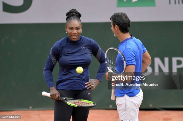 Serena Williams of Sthe United States of America speaks with her coach Patrick Mouratoglou during a training session ahead of the French Open at...