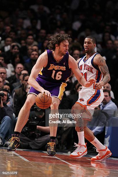Pau Gasol of the Los Angeles Lakers posts up against Wilson Chandler of the New York Knicks during their game at Madison Square Garden on January 22,...