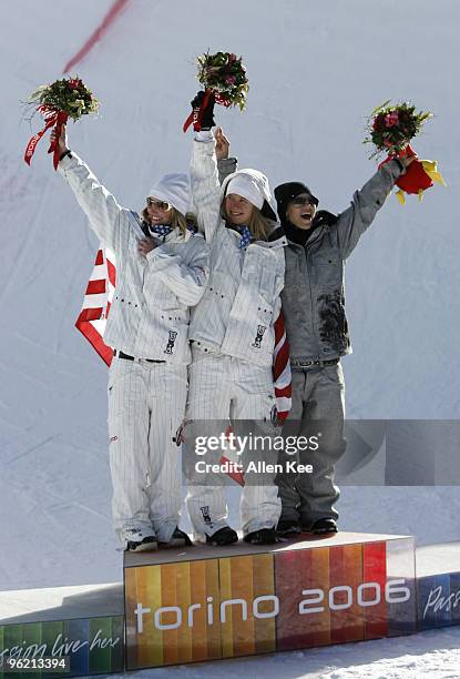 Gretchen Bleiler and Hannah Teter of the United States celebrate with Kjersti Buaas of Norway on the medal podium during the Women's Snowboard...