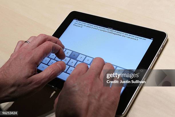 An event guest plays with the new keyboard on a Apple iPad during an Apple Special Event at Yerba Buena Center for the Arts January 27, 2010 in San...