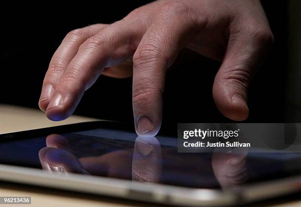 An event guest plays with the new Apple iPad during an Apple Special Event at Yerba Buena Center for the Arts January 27, 2010 in San Francisco,...