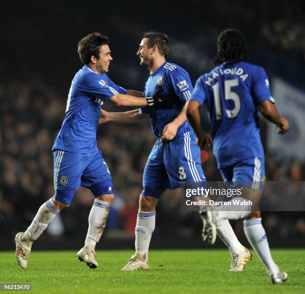 Frank Lampard of Chelsea celebrates his goal with team mate Deco during the Barclays Premier League match between Chelsea and Birmingham City at...