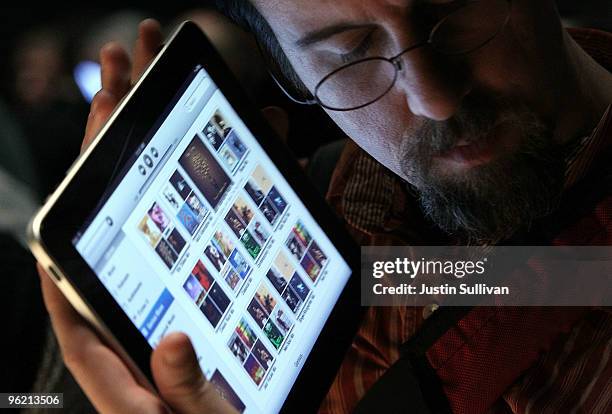 An event guest plays with the new Apple iPad during an Apple Special Event at Yerba Buena Center for the Arts January 27, 2010 in San Francisco,...