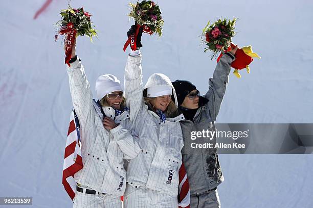 Gretchen Bleiler and Hannah Teter of the United States celebrate with Kjersti Buaas of Norway on the medal podium during the Women's Snowboard...