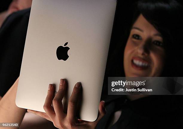 An event guest plays with the new Apple iPad during an Apple Special Event at Yerba Buena Center for the Arts January 27, 2010 in San Francisco,...