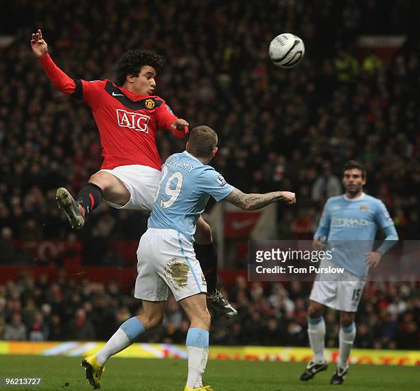 Rafael Da Silva of Manchester United clashes with Craig Bellamy of Manchester City during the Carling Cup Semi-Final Second Leg match between...