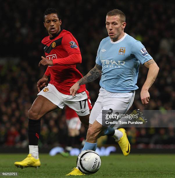 Nani of Manchester United clashes with Craig Bellamy of Manchester City during the Carling Cup Semi-Final Second Leg match between Manchester United...
