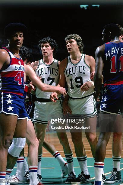 Don Nelson and John Havlicek of the Boston Celtics stand against the Washington Bullets during a game played in 1975 at the Boston Garden in Boston,...