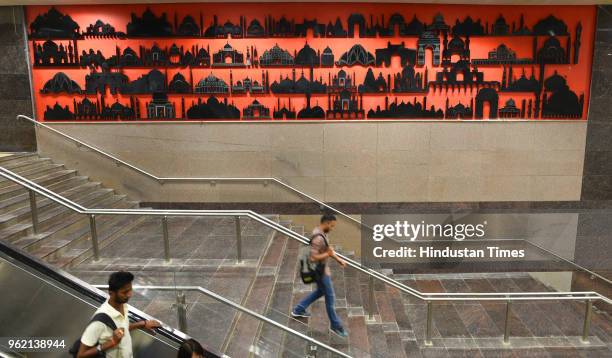 Passengers walk down the stairs at Hauz Khas Metro Station on Magenta Line Metro during a press preview on May 24, 2018 in New Delhi, India. The...