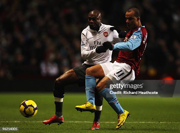 William Gallas of Arsenal and Gabriel Agbonlahor of Aston Villa challenge for the ball during the Barclays Premier League match between Aston Villa...