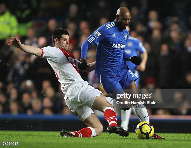 Nicolas Anelka of Chelsea is tackled by Scott Dann of Birmingham City during the Barclays Premier League match between Chelsea and Birmingham City at...