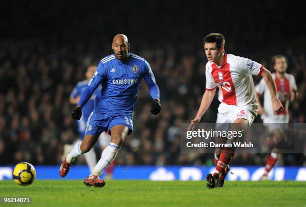 Nicolas Anelka of Chelsea passes the ball watched by Scott Dann of Birmingham City during the Barclays Premier League match between Chelsea and...