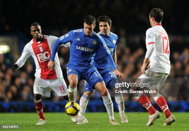 Michael Ballack of Chelsea is closed down by Christian Benitez and Barry Ferguson of Birmingham City during the Barclays Premier League match between...