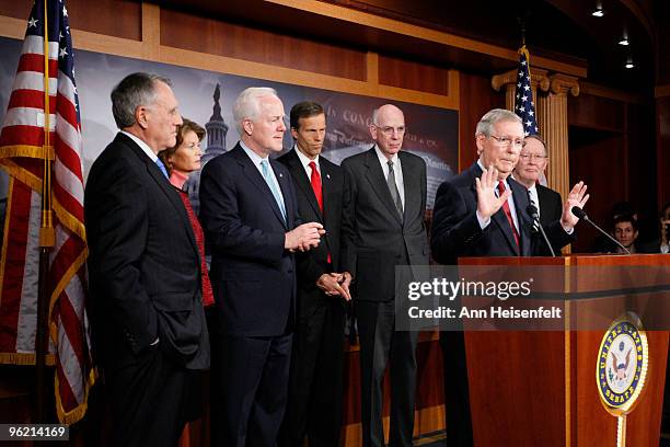 Senate Minority Leader Mitch McConnell takes a question as GOP senators hold a media availability following the Senate Republican Annual meeting...