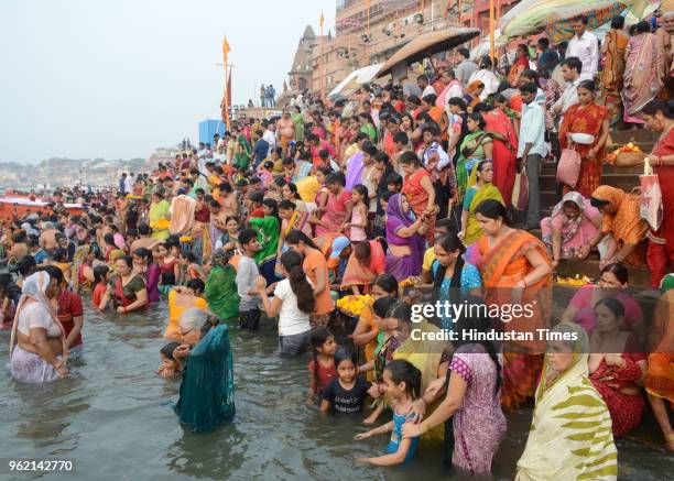 Devotees gather to take a holy dip in River Ganga on the occasion of 'Ganga Dussehra' at Sheetla Ghat on May 24, 2018 in Varanasi, India. It is...