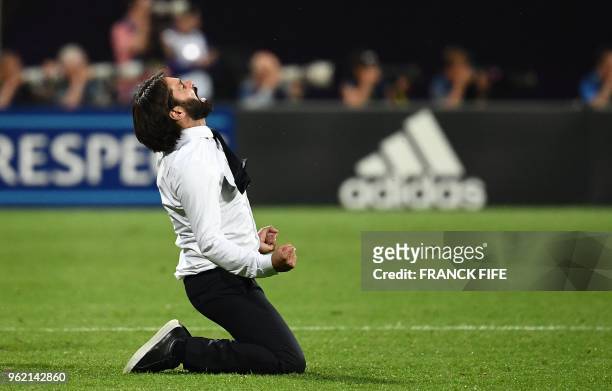 Olympique Lyonnais' French coach Reynald Pedros celebrates after his team scored during the UEFA Women's Champions League final football match Vfl...