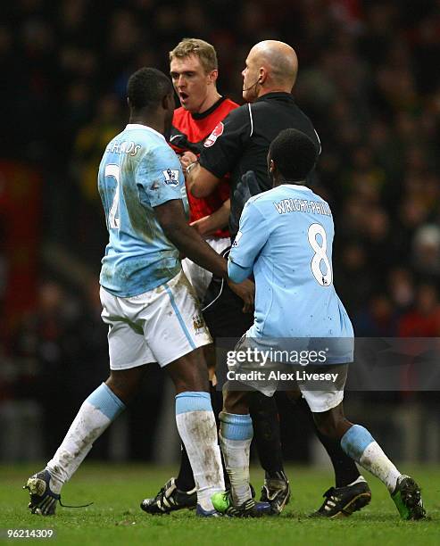 Darren Fletcher of Manchester United confronts Micah Richards of Manchester City during the Carling Cup Semi Final second leg match between...