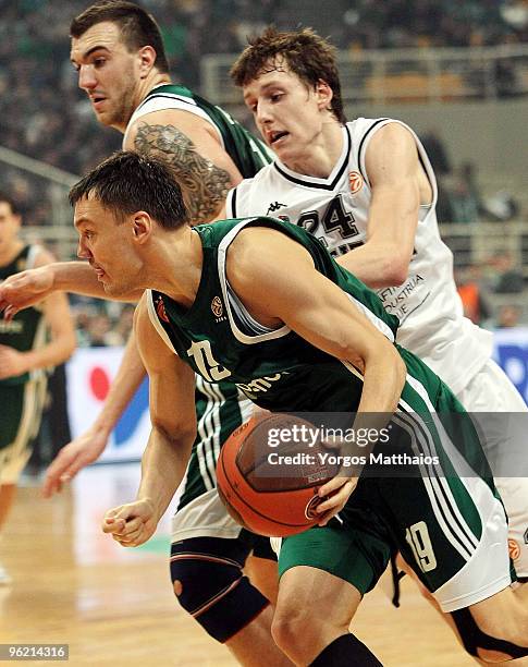 Sarunas Jasikevicius, #19 of Panathinaikos Athens competes with Jan Vesely, #24 of Partizan Belgrade during the Euroleague Basketball 2009-2010 Last...