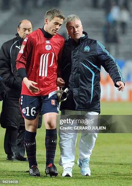 Marseille's head coach Didier Deschamps speaks with Lille's goalkeeper Mickaël Landreau at the end of the French League Cup football match Marseille...