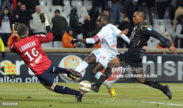 Marseille's forward Mamadou Niang kicks the ball in front of Lille's goalkeeper Mickael Landreau during the French League Cup football match...
