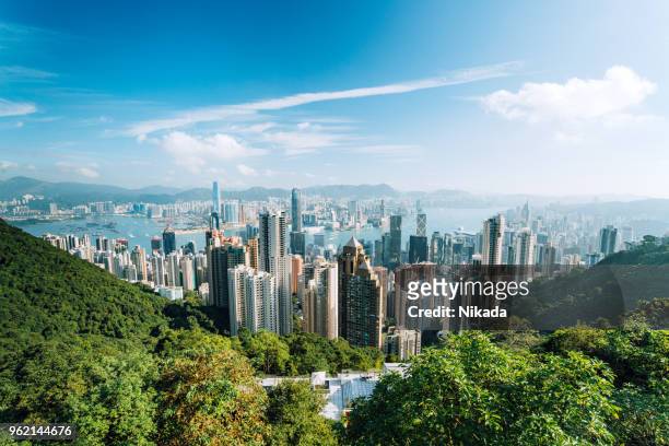 hong kong skyline with clouds - hongkong stock pictures, royalty-free photos & images