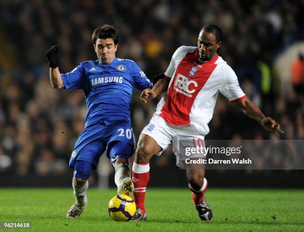 Deco of Chelsea is challenged by Cameron Jerome of Birmingham City during the Barclays Premier League match between Chelsea and Birmingham City at...