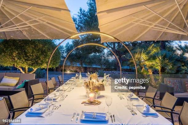 elegant table for dinning at sunset - pepmiba stock pictures, royalty-free photos & images