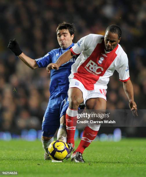 Deco of Chelsea challenges Cameron Jerome of Birmingham City during the Barclays Premier League match between Chelsea and Birmingham City at Stamford...