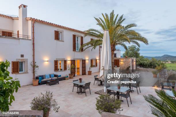 hotel facade at night - landscape design front of house stock pictures, royalty-free photos & images
