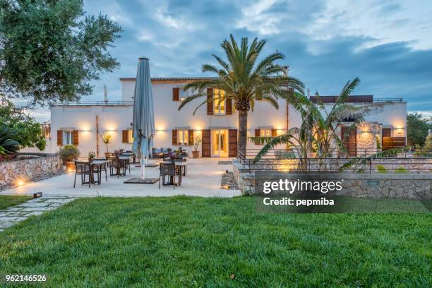 hotel facade at night - landscape design front of house stock pictures, royalty-free photos & images