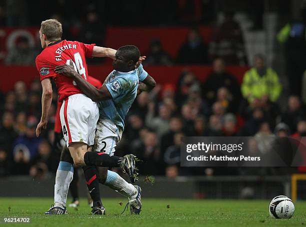 Darren Fletcher of Manchester United clashes with Micah Richards of Manchester City during the Carling Cup Semi-Final Second Leg match between...